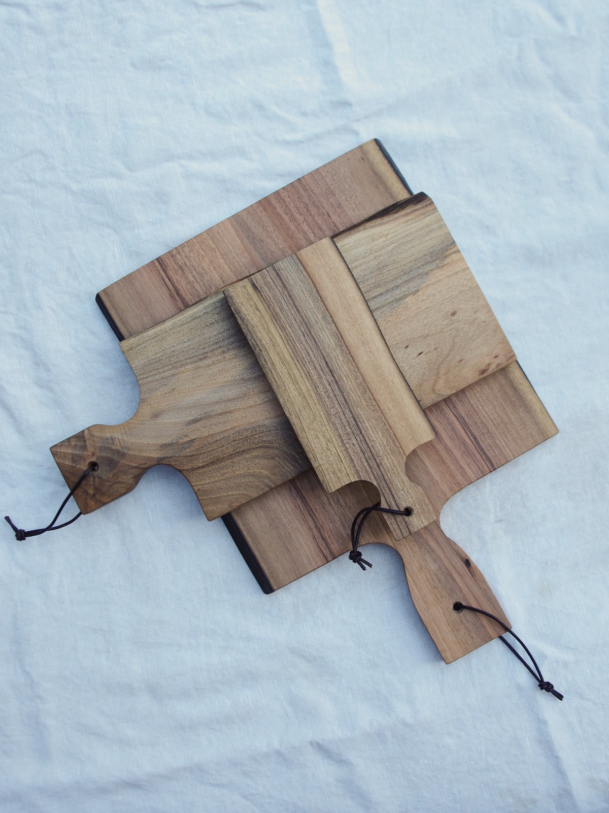 Stack of walnut cutting boards.