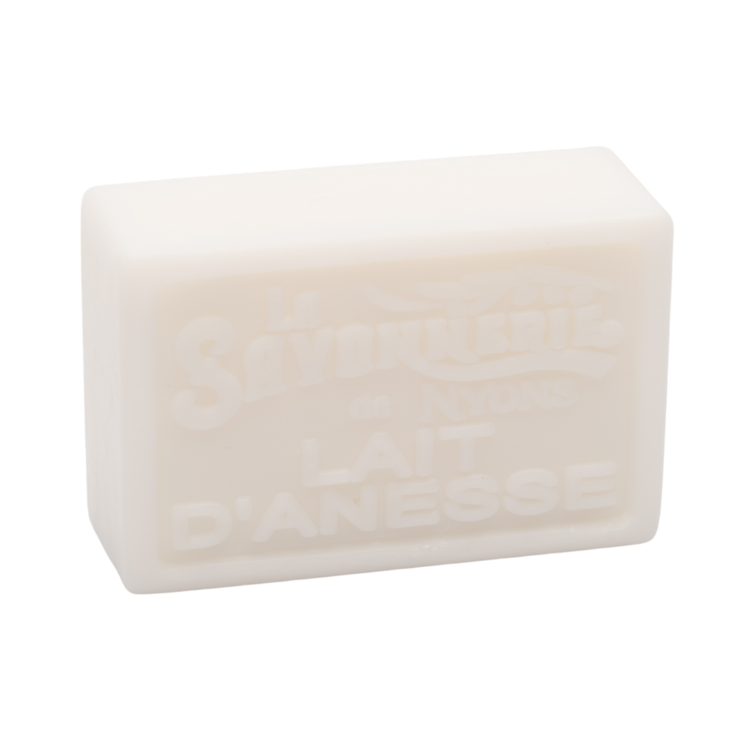 White bar of soap that reads La Savonnerie de Nyons Lait d'anesse.