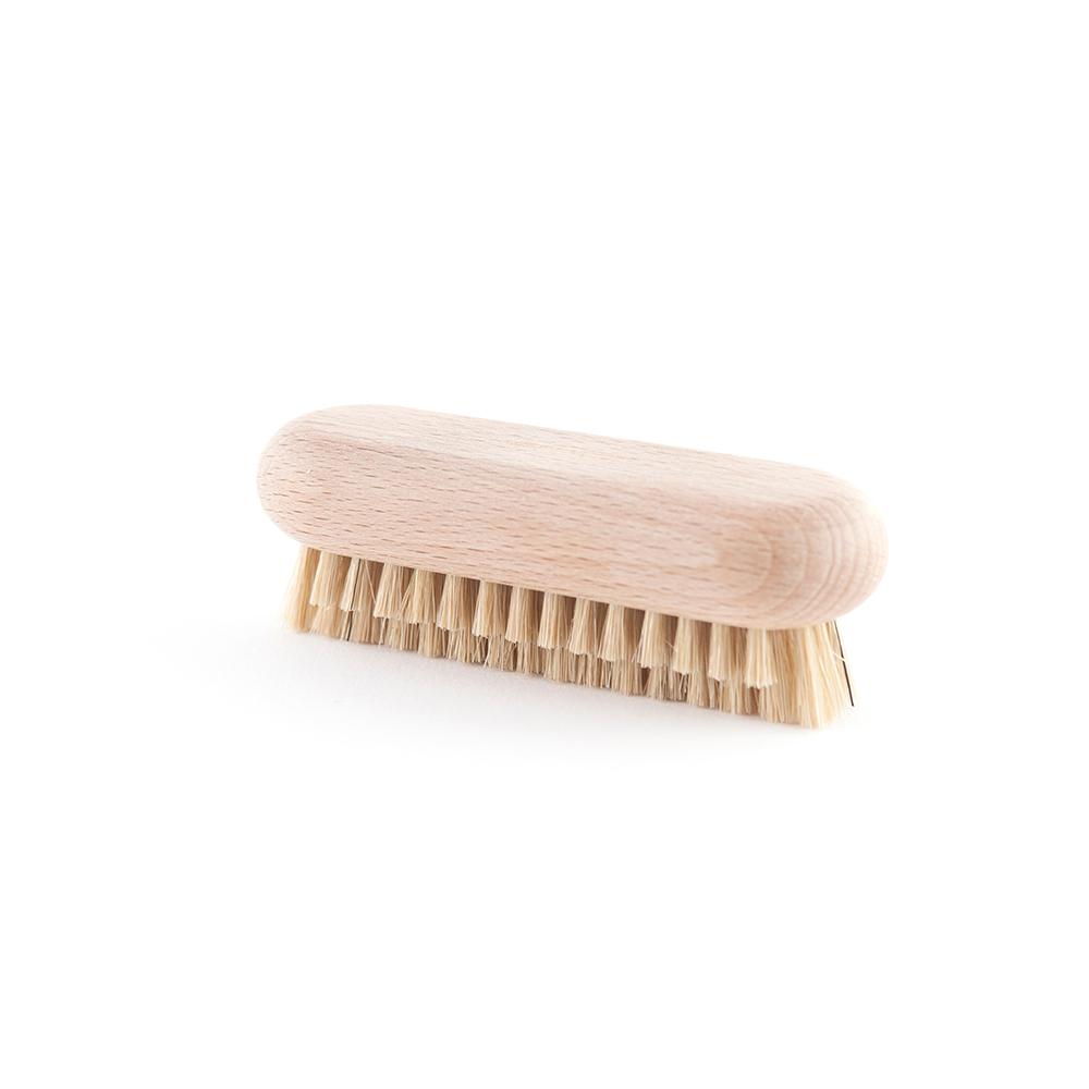 Natural dish brush with two layers of bristles.